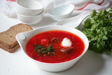 Traditional Ukrainian Russian borscht . Bowl of red beet root soup borsch with white cream . Beet Root delicious soup . Traditional Ukrain food cuisine 