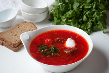 Traditional Ukrainian Russian borscht . Bowl of red beet root soup borsch with white cream . Beet Root delicious soup . Traditional Ukrain food cuisine 