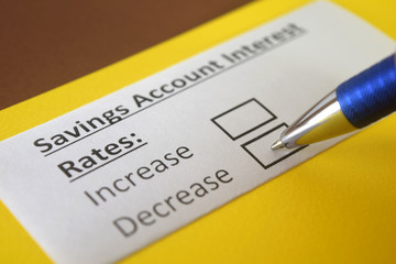 Obraz premium One person is answering question about savings account interest rates.
