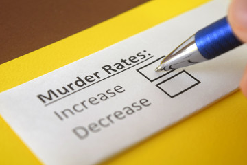 Obraz premium One person is answering question about murder rates.