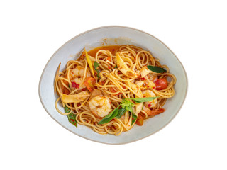 Spicy shrimps spaghetti pasta (Tom Yum Goong) isolated on white background with clipping path.