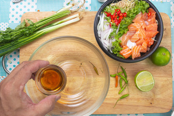 Chef prepared cook spicy salmon salad with fish sauce