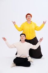 Studio portrait of funny couple posing 