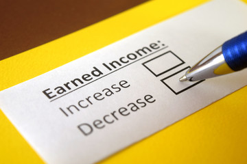 Obraz premium One person is answering question about earned income.