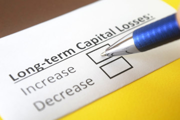 Obraz premium One person is answering question about long term capital losses.