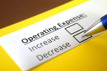 Obraz premium One person is answering question about operating expense.
