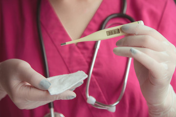 Doctor medical Showing thermometer Of patients with high temperatures. The preliminary symptoms observed by the corona virus infection are high fever. COVID-19 pandemic virus outbreak concept.