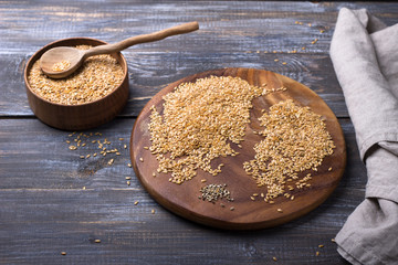 Golden flax seeds on wooden table. trash removal process. healthy vegan superfood	