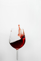 splash  of red wine on a white background
