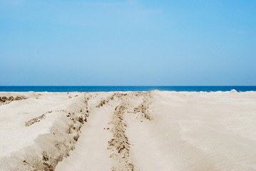 Sea sand on a background of blue sky