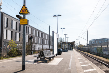 Deserted sunny trainstation, empty seats, in Rahlstedt