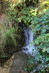 Small waterfall flowing down the side of the path at Langsett Reservoir