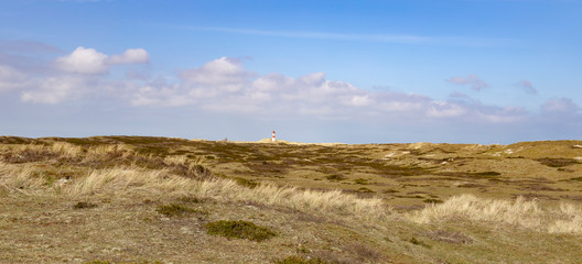 dunes with small lighthouse