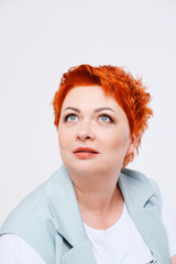portrait of surprised redhead woman