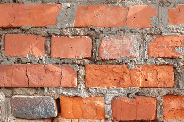 Weathered red brick wall texture and grey cement. Seamless texture background for exterior of building.
