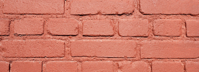 Red brick wall with cracks and scratches. Аbstract background texture. Banner.