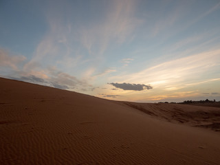 Naklejka na ściany i meble Scenic View Of Desert Against Sky During Sunset