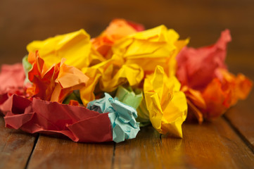 Many crumpled colorful paper background. Close-up.