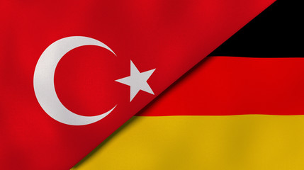 The flags of Turkey and Germany. News, reportage, business background. 3d illustration