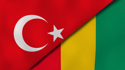 The flags of Turkey and Guinea. News, reportage, business background. 3d illustration