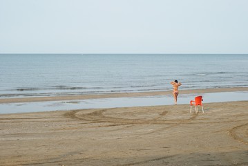 Woman on the beach. Girl on the seashore.