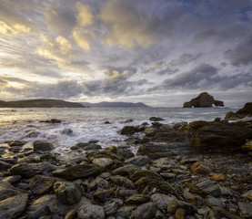 Cloudy Sky and Sea Surf in the Rocky Coast of Loiba