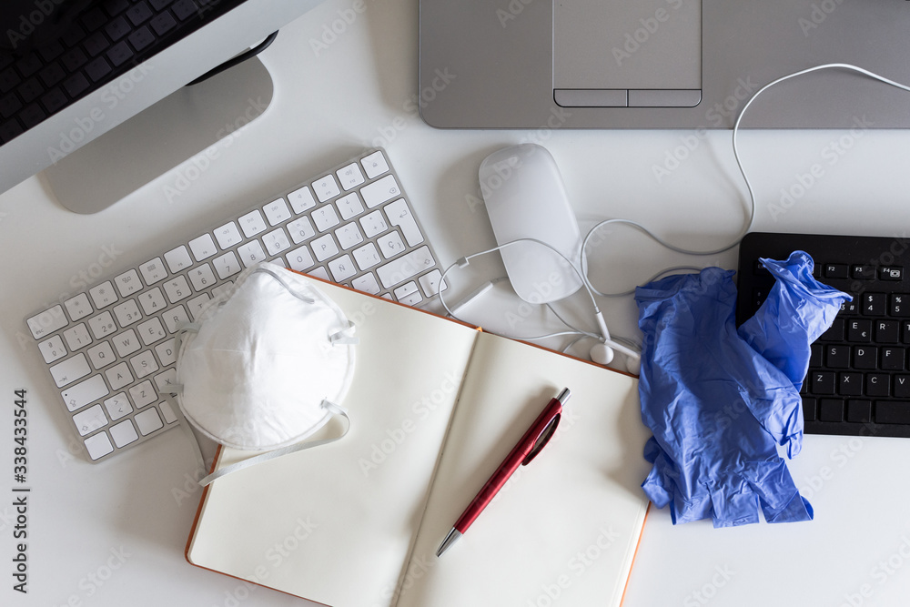 Fototapete medical mask and gloves on the desktop. remote work and study. telework, freelance. notepad with pla
