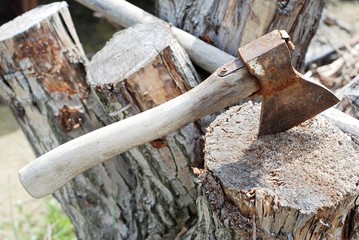 Ax on the stump,felling of firewood,old ax with wooden handle