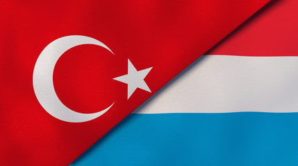 The flags of Turkey and Luxembourg. News, reportage, business background. 3d illustration