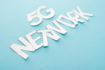 white 5g network lettering on blue background