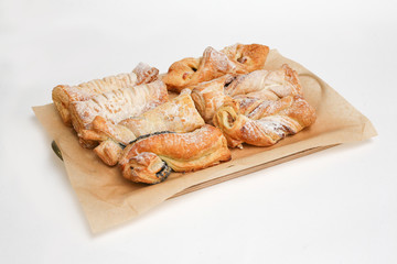 puff buns with poppy seeds white background