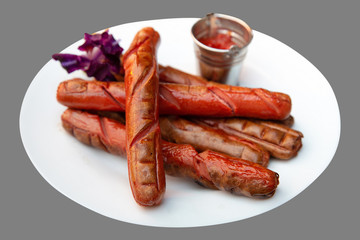 grilled beautiful delicious sausages on a white plate with no background for your design or menu