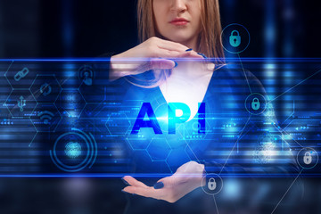 Business, Technology, Internet and network concept. Young businessman working on a virtual screen of the future and sees the inscription: API