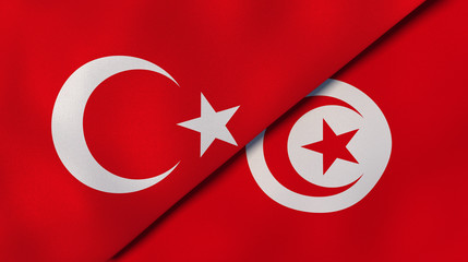 The flags of Turkey and Tunisia. News, reportage, business background. 3d illustration