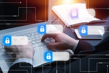 Hacker attack and data breach, information concept. Human hands with laptop