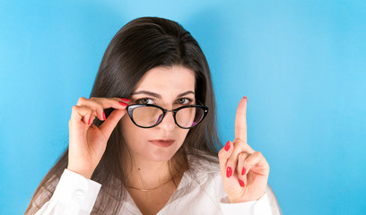 Business lady wearing black glasses posing having idea.