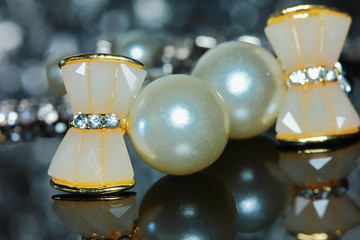 beautiful pearl earrings of woman in macro for background