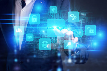 Business, Technology, Internet and network concept. Young businessman working on a virtual screen of the future and sees the inscription: Leadership