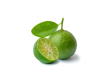 Green lemons with lemon slices and halves on a white background with the clipping path.