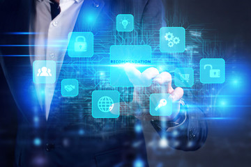 Business, Technology, Internet and network concept. Young businessman working on a virtual screen of the future and sees the inscription: Recommendation