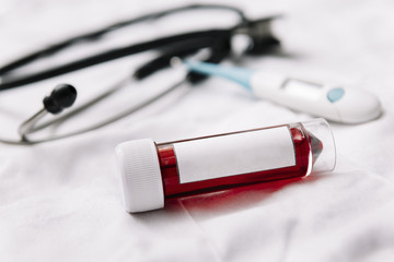 vial with blood sample with blank label