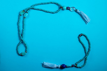 Two blue oriental Japa Mala (mala Sanskrit) - Blue background 1