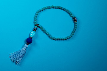 Small Blue oriental Japa Mala (mala Sanskrit) - Blue background