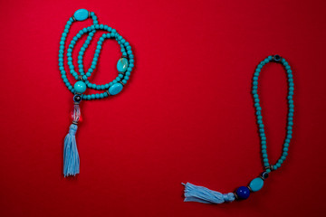 Two blue oriental Japa Mala (mala Sanskrit) - Red background 1