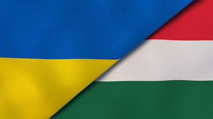 The flags of Ukraine and Hungary. News, reportage, business background. 3d illustration