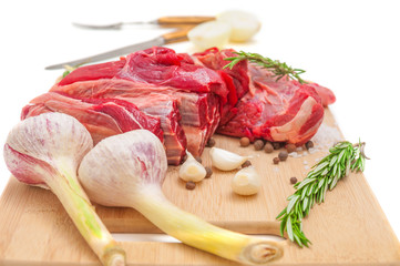 Fresh raw meat and spices on cutting board