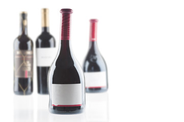Red wine bottles isolated on white background