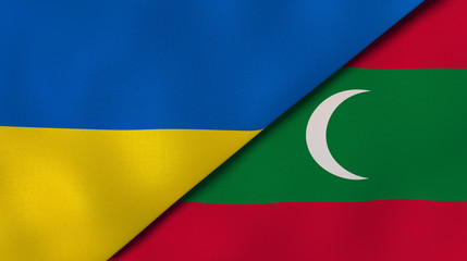 The flags of Ukraine and Maldives. News, reportage, business background. 3d illustration