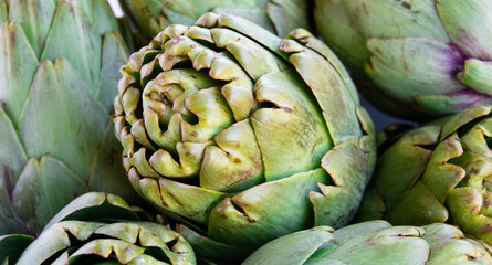 Obraz premium Group of green artichokes. Can be used as a background