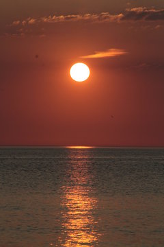 White sun in a firesky